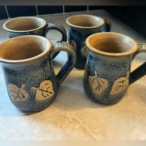 Set of 4 small leaf-print coffee mugs.